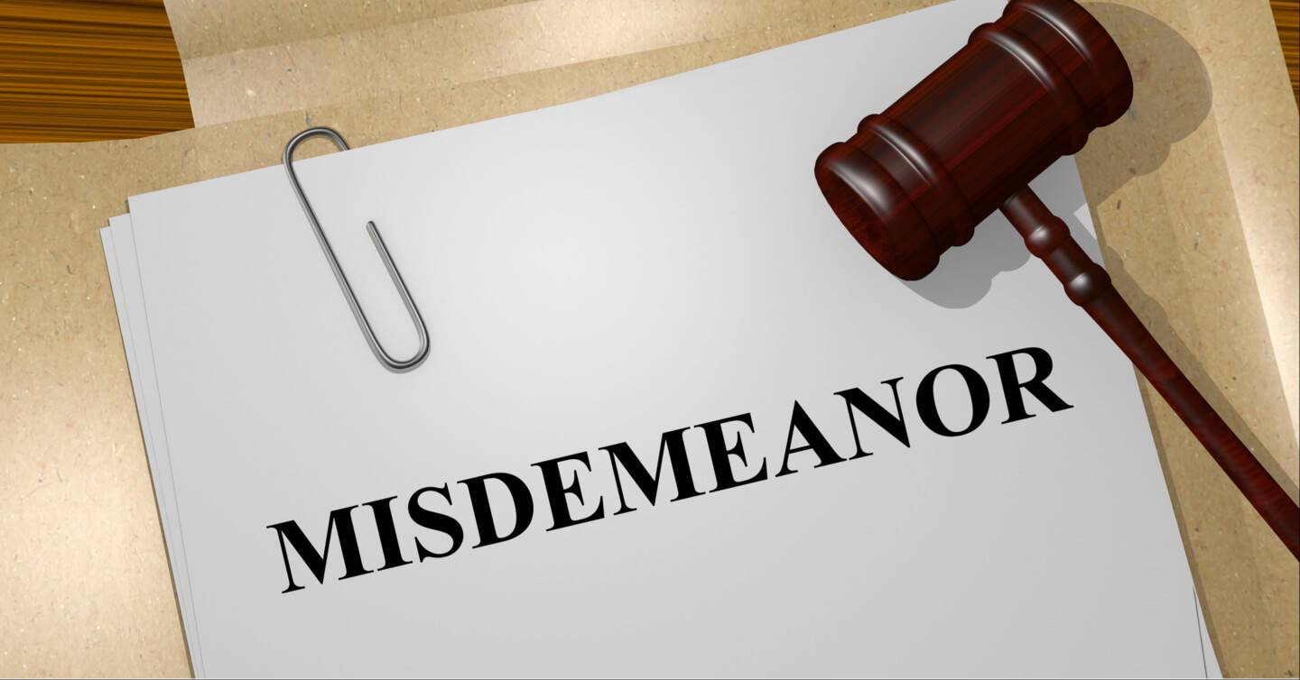 misdemeanor charges on a paper with gavel
